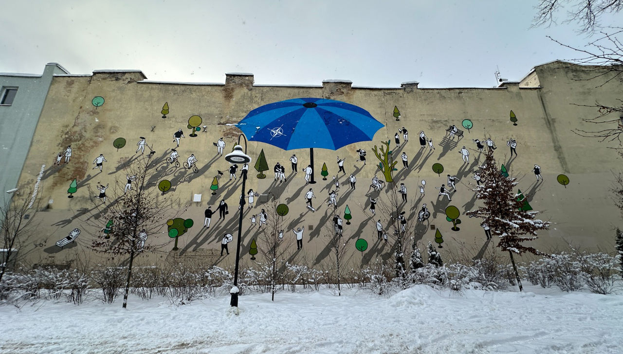 You can stand under my umbrella: NATO unveils street mural in Lithuania by Lithuanian street artist and co-founder of the “Living Graphics” art collective, Žygimantas Amelynas.