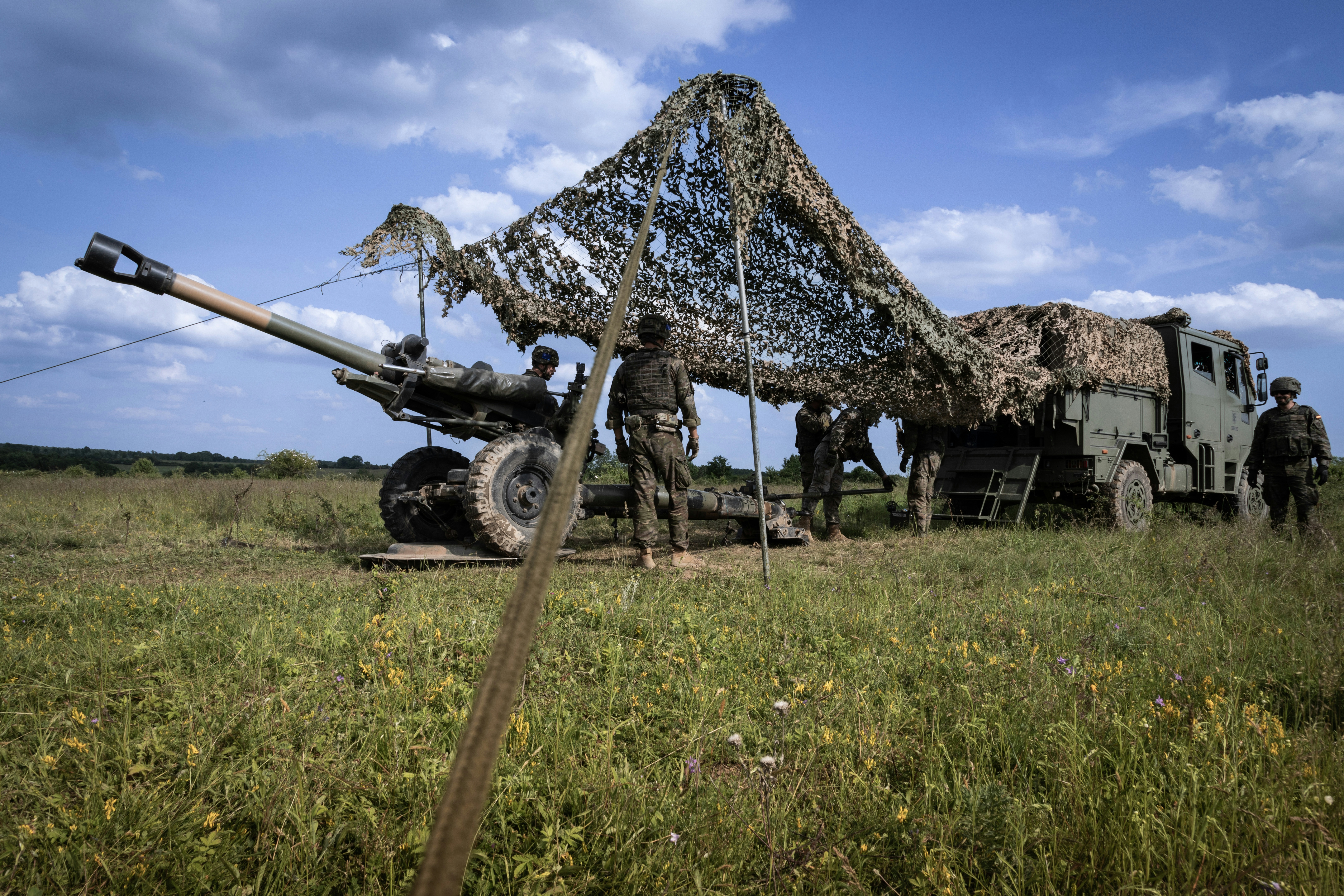 A Turkish naval crewman signals to a Seahawk helicopter during exercise Dynamic Manta. Mediterranean Sea, February 2024.